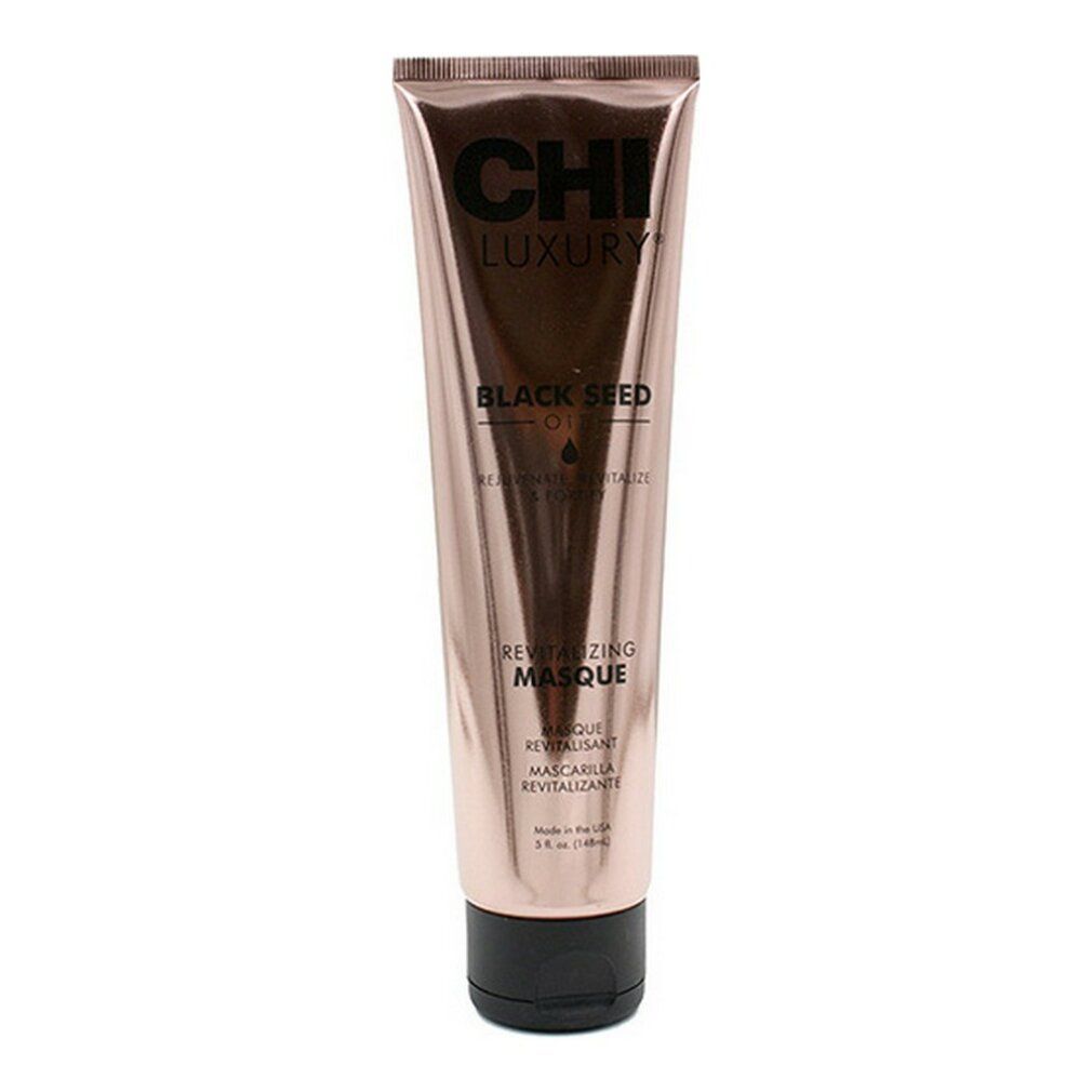 Tubo rosa con tappo nero. Scritta: CHI LUXURY, BLACK SEED OIL, REVITALIZING MASQUE.