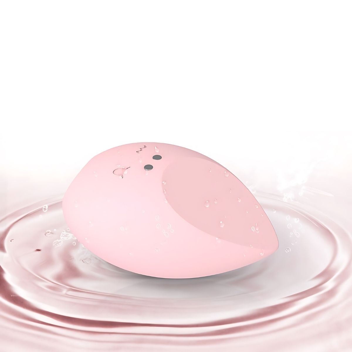 Vibratore Rosa a goccia. Rosa, con due pulsanti e un design ondulato e arcuato. Giace nell'acqua.