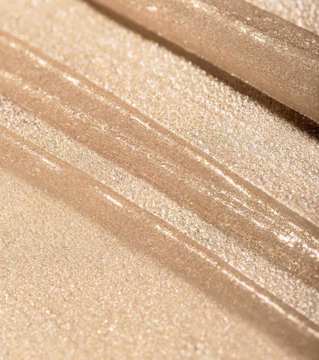 Ombretto dorato glitterato con strisce.