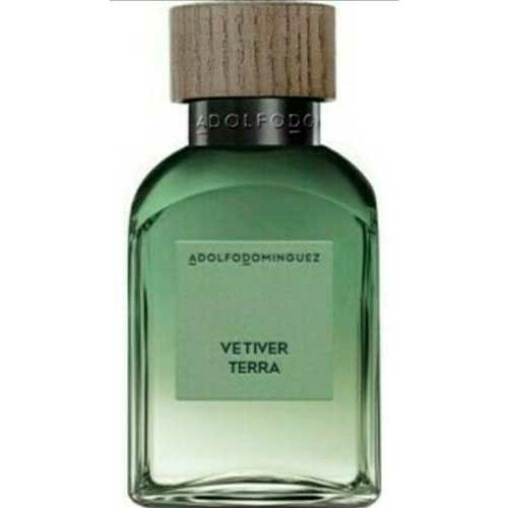 Flacone di vetro verde con tappo in legno. Scritta: VETIVER TERRA. Marchio: ADOLFODOMINGUEZ.