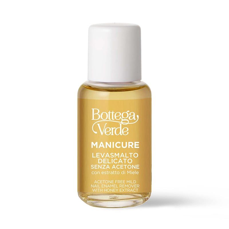 Flacone di solvente per unghie trasparente. Tappo bianco, liquido giallo. Testo: Bottega Verde, Levasmalto delicato senza acetone.