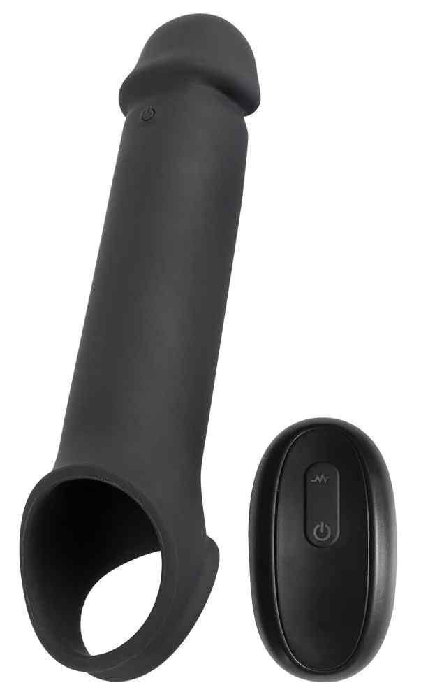 Rivestimento per pene nero con anello per le palle e telecomando. Il rivestimento è di forma allungata con un anello all'estremità. Il telecomando è ovale.