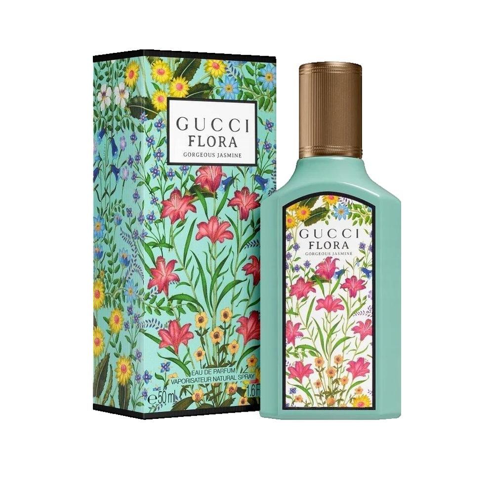 Flacone turchese e scatola con motivo floreale. Scritta Gucci Flora Gorgeous Jasmine. Tappo dorato.