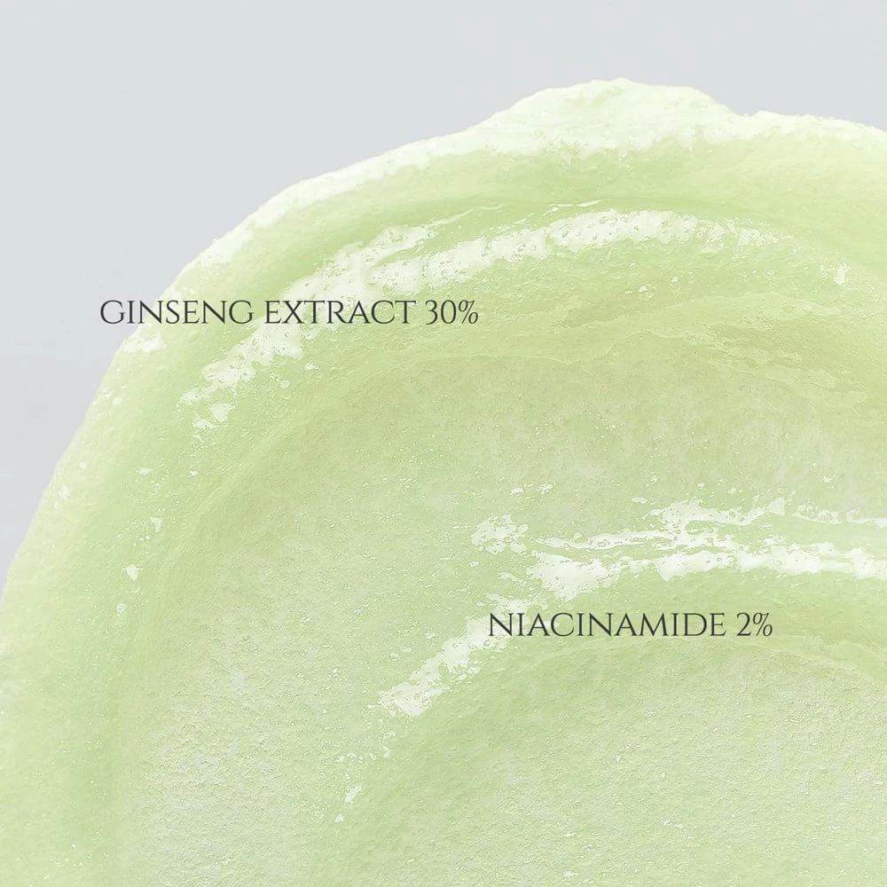 Primo piano di una crema verde. Testo: Ginseng Extract 30%, Niacinamide 2%.