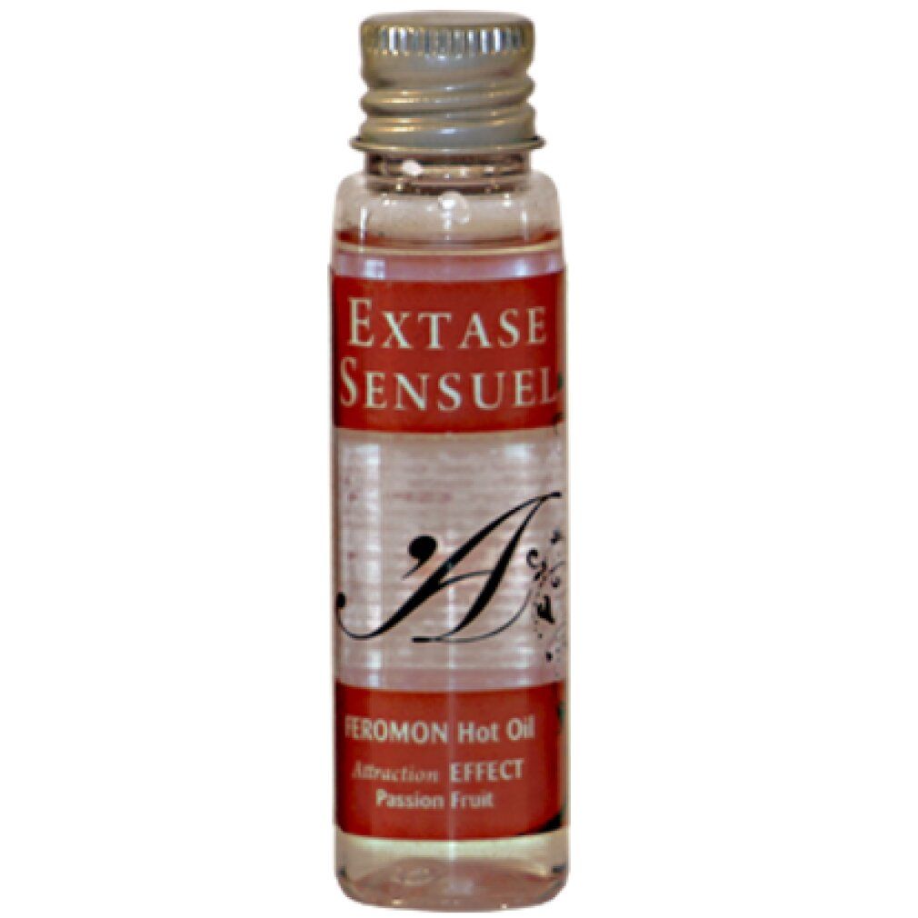 Piccola bottiglia di olio trasparente, etichetta con 'EXTASE SENSUEL' e 'FEROMON Hot Oil'.