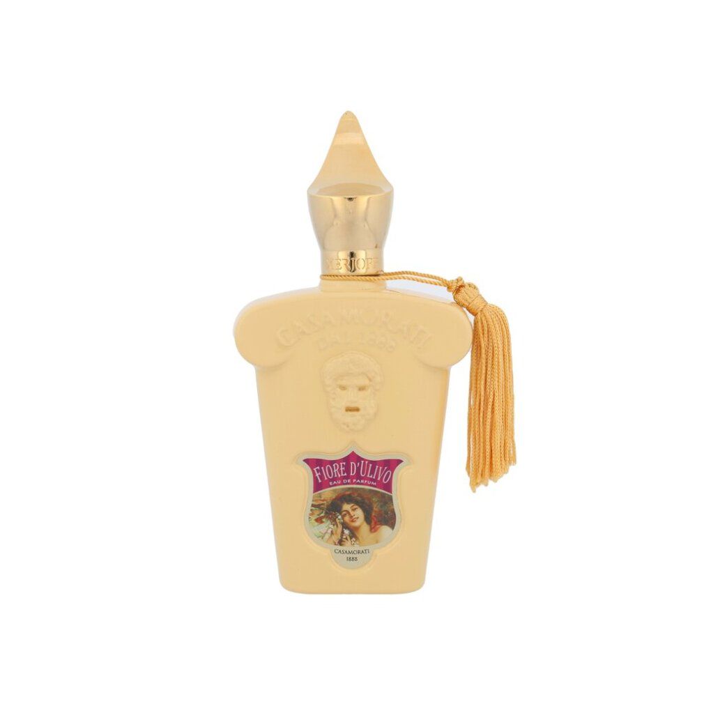 Flacone di profumo beige con tappo dorato e nappa. Scritte Fiore d'Ulivo e Casamorati.