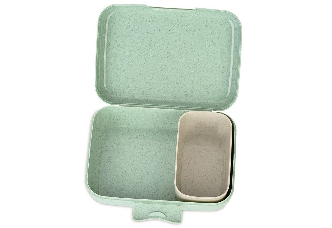 Lunch box verde aperta. Forma rettangolare con contenitore separato. Plastica. Interno beige.