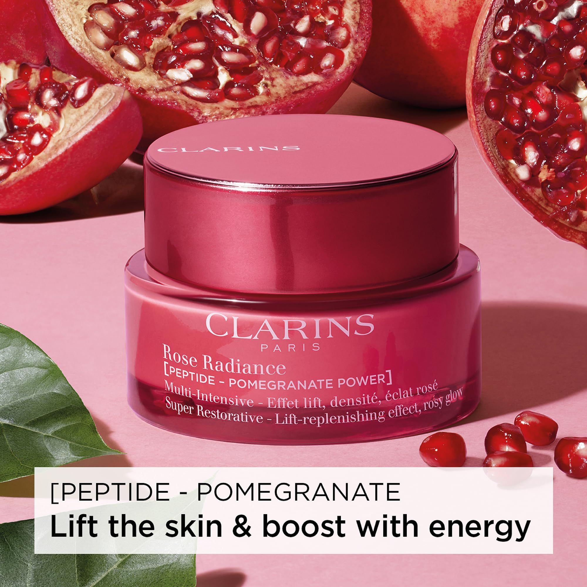 Vasetto di crema rosso con coperchio, melograni sullo sfondo. Scritta: CLARINS PARIS, Rose Radiance, [PEPTIDE - POMEGRANATE POWER].