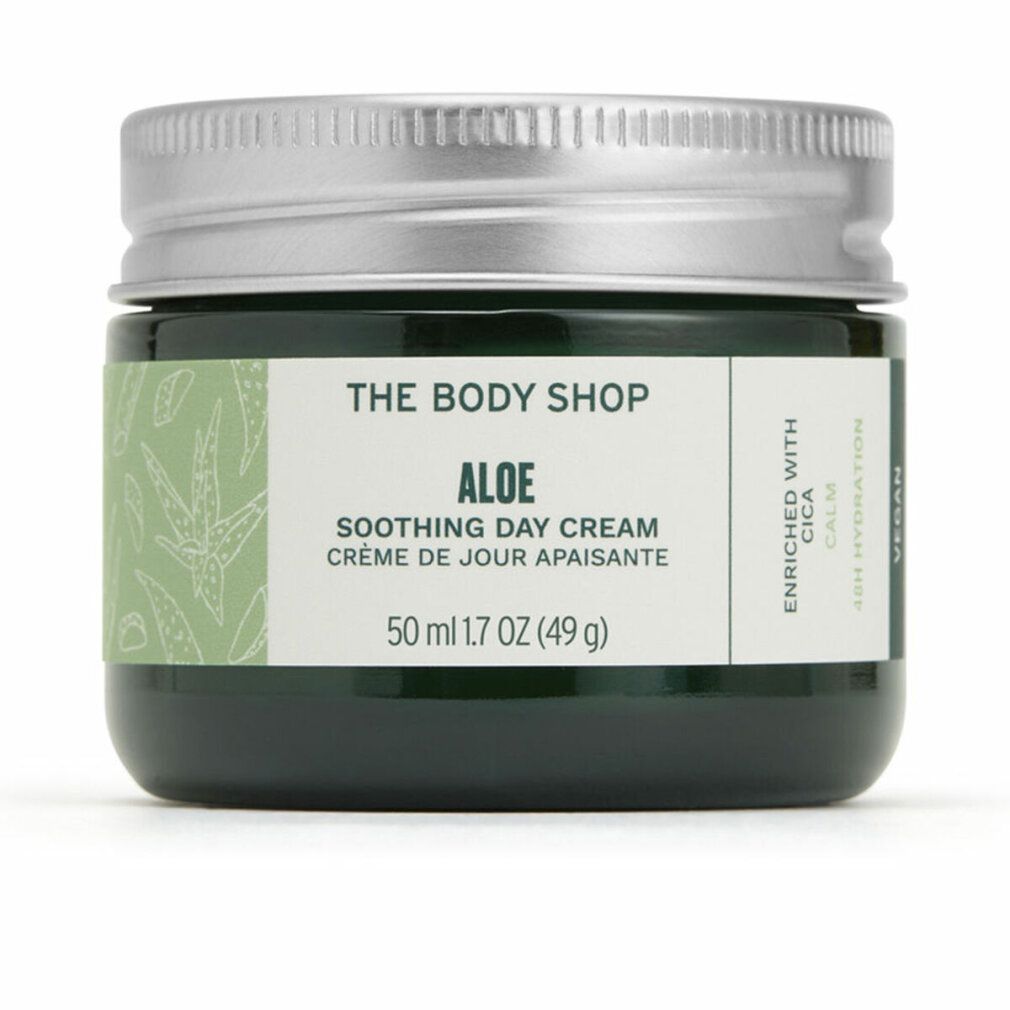 Vasetto di vetro verde con coperchio argentato. Etichetta con nome del prodotto e informazioni. Scritta: Aloe Soothing Day Cream.