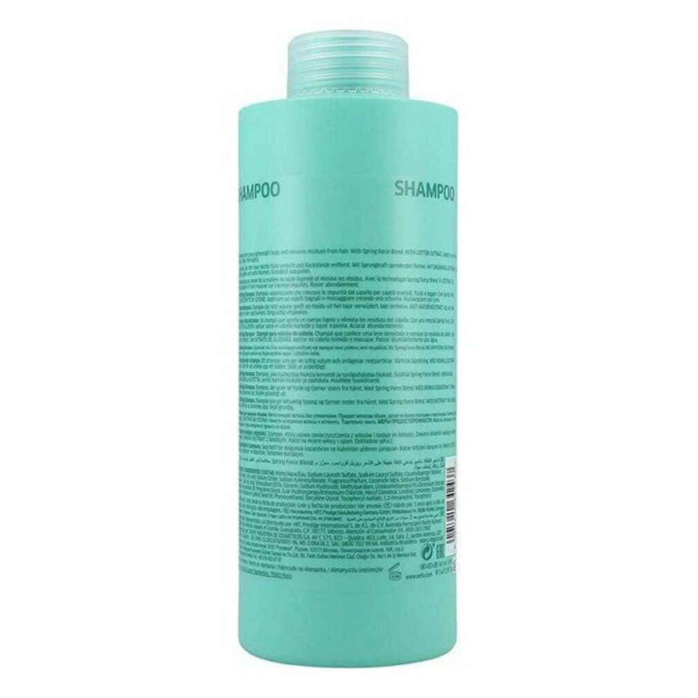 Retro di un flacone di shampoo turchese. Testo in più lingue. Codice a barre e informazioni del produttore.