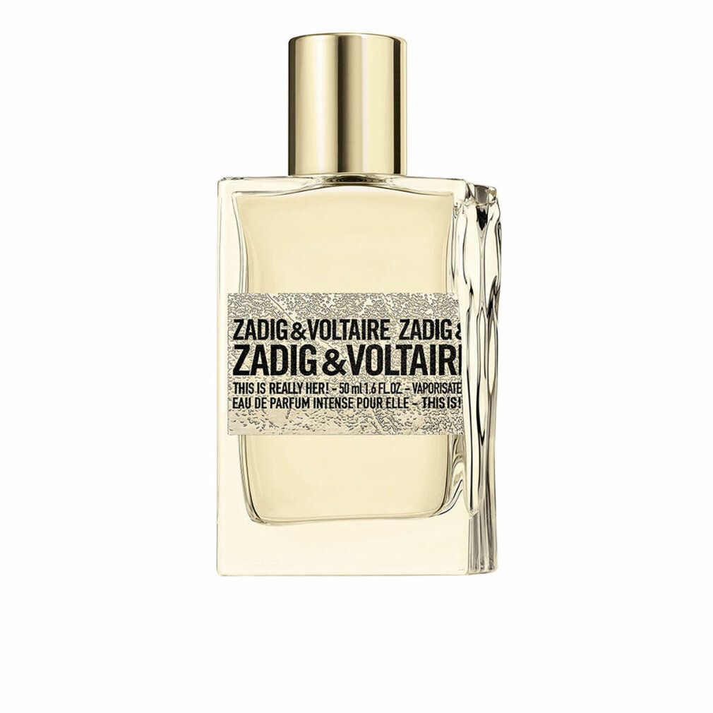 Flacone di profumo Zadig & Voltaire. Forma rettangolare, tappo dorato. Etichetta con nome e dettagli del prodotto.