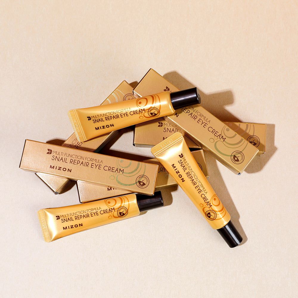 Diversi tubi e scatole. Scritta: Mizon Snail Repair Eye Cream.