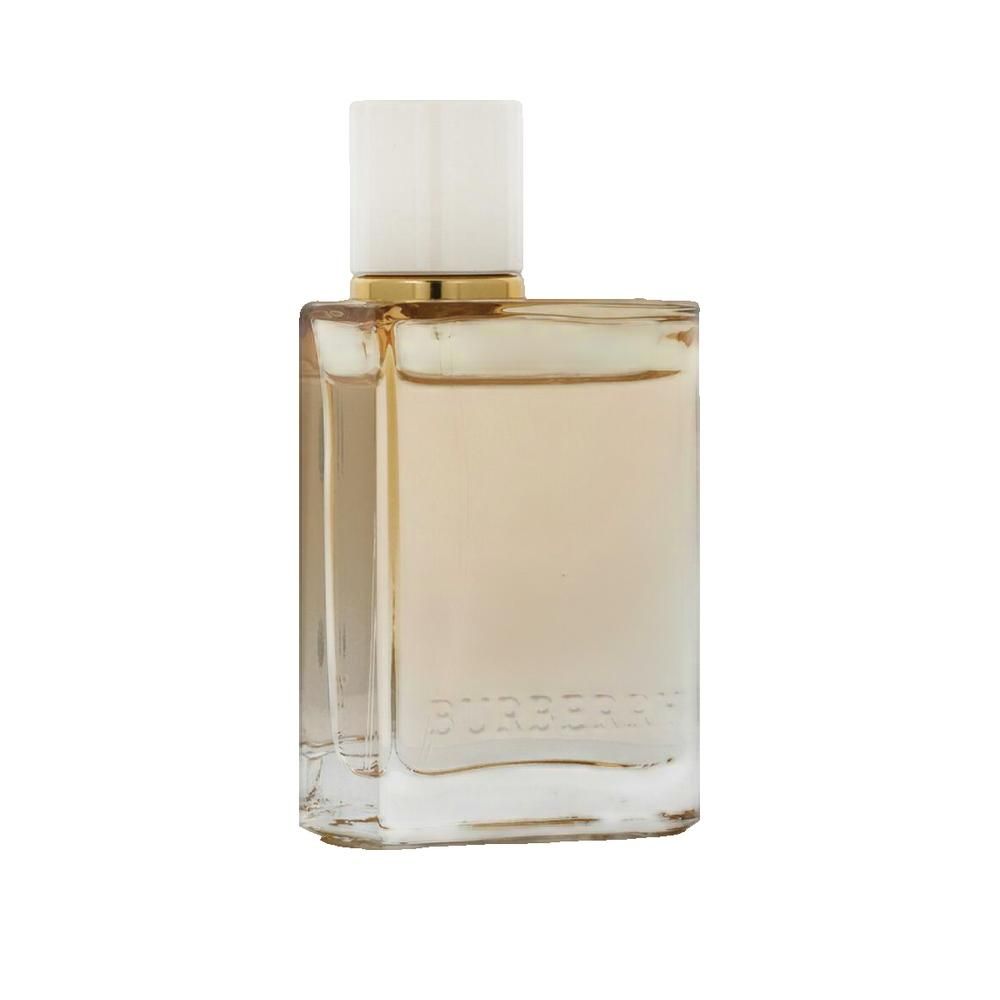 Flacone quadrato in vetro con liquido beige e tappo chiaro. Anello dorato sul collo.