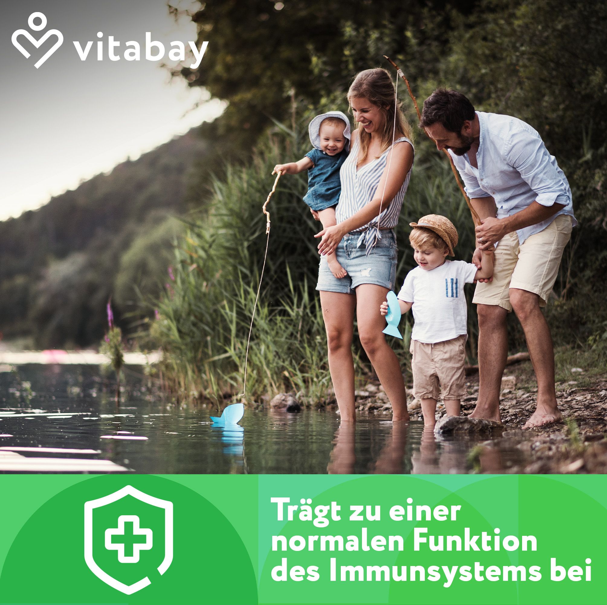 Famiglia al lago. Testo: "Contribuisce alla normale funzione del sistema immunitario". Logo: scudo verde con croce.