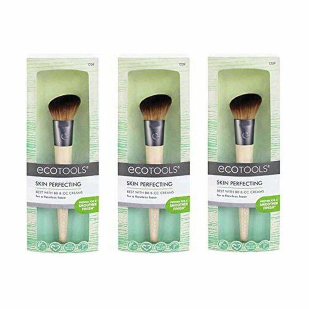 Tre pennelli Ecotools Skin Perfecting in confezione. Setole nere, ghiera argentata, manico in legno chiaro. Nome del prodotto visibile.