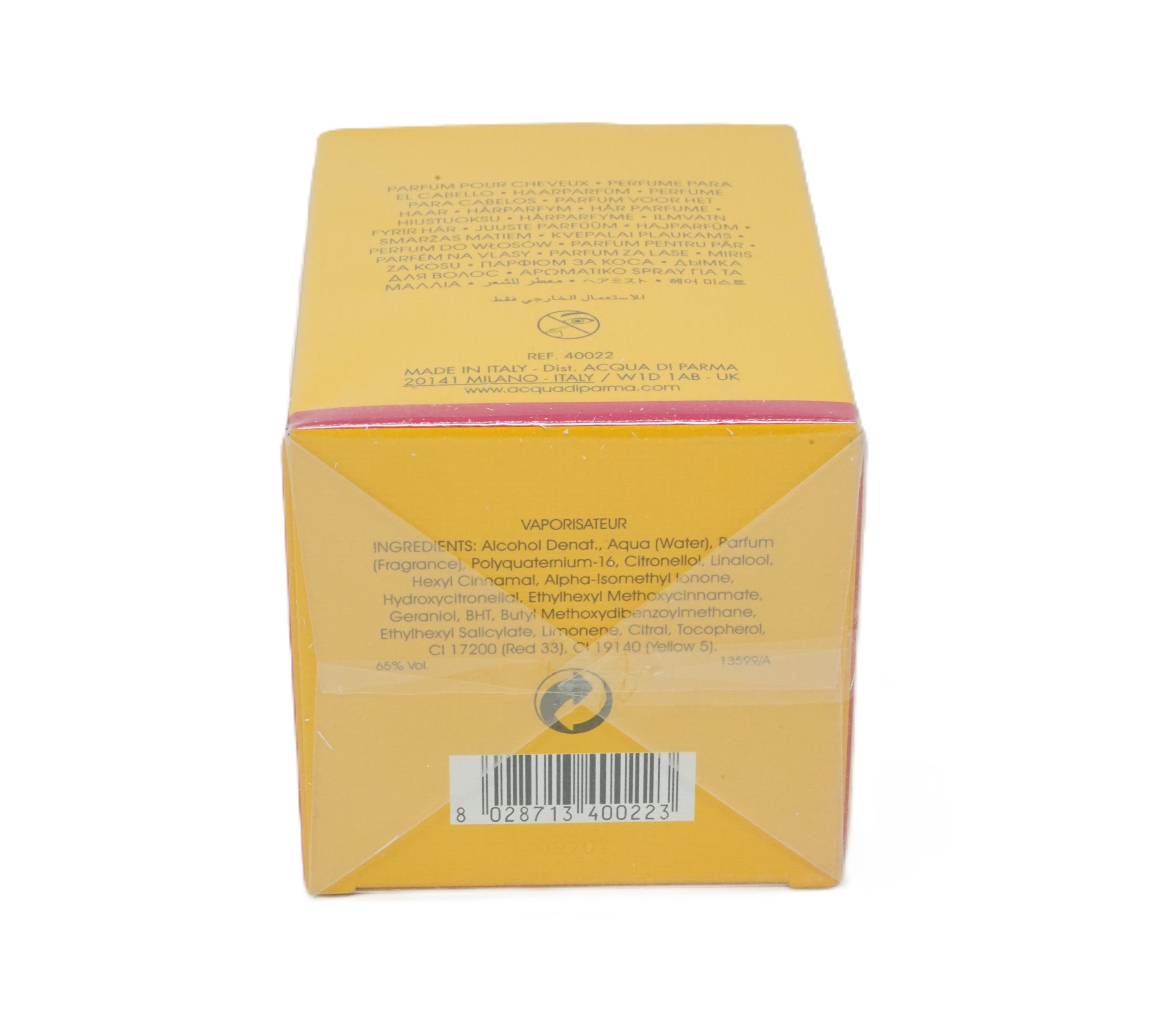 Scatola gialla, retro con testo. Codice a barre in basso. Accento rosa sul bordo.