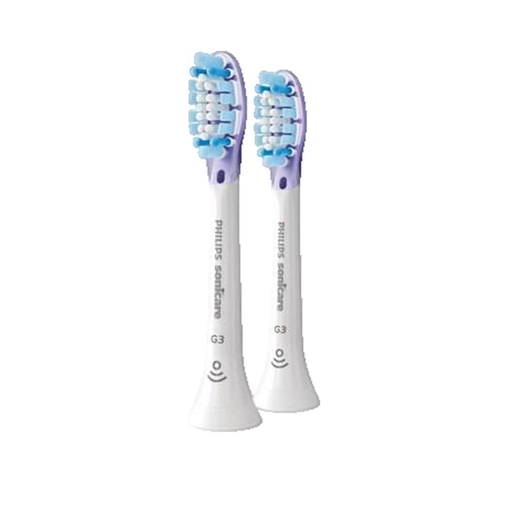 Due testine bianche con dettagli viola. Setole blu e bianche. Scritta "Philips Sonicare G3".