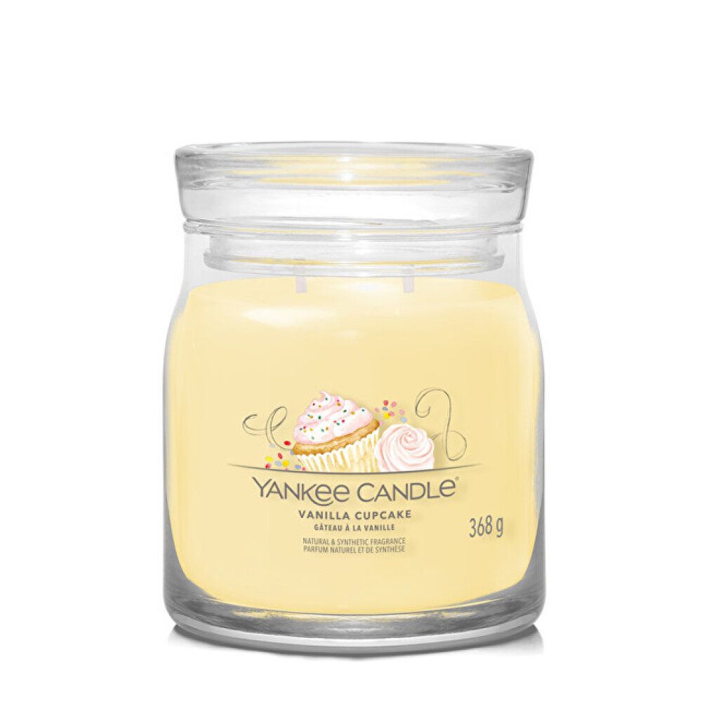 Contenitore di vetro con cera gialla. Adesivo con cupcake e testo. Coperchio. 368 g.