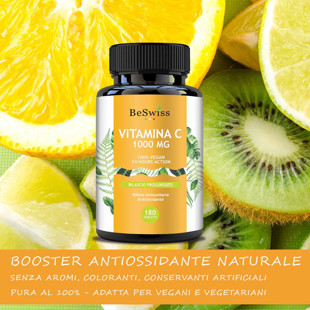 Flacone BeSwiss Vitamina C 1000mg, circondato da agrumi. Etichetta gialla. 180 compresse. Vegan.