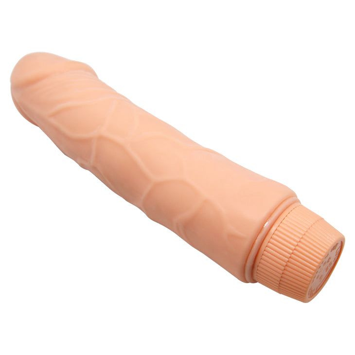 Dildo realistico beige, base scanalata, superficie dettagliata. Vene verticali sul fusto.