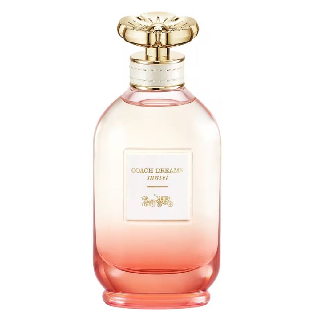 Flacone di profumo con tappo dorato. Scritta: Coach Dreams Sunset. Sfumatura da rosa ad arancione.