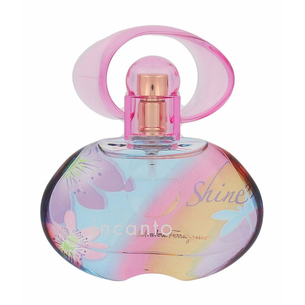 Flacone rotondo con tappo rosa. Scritta: Incanto Shine, Salvatore Ferragamo. Motivo floreale sul flacone.