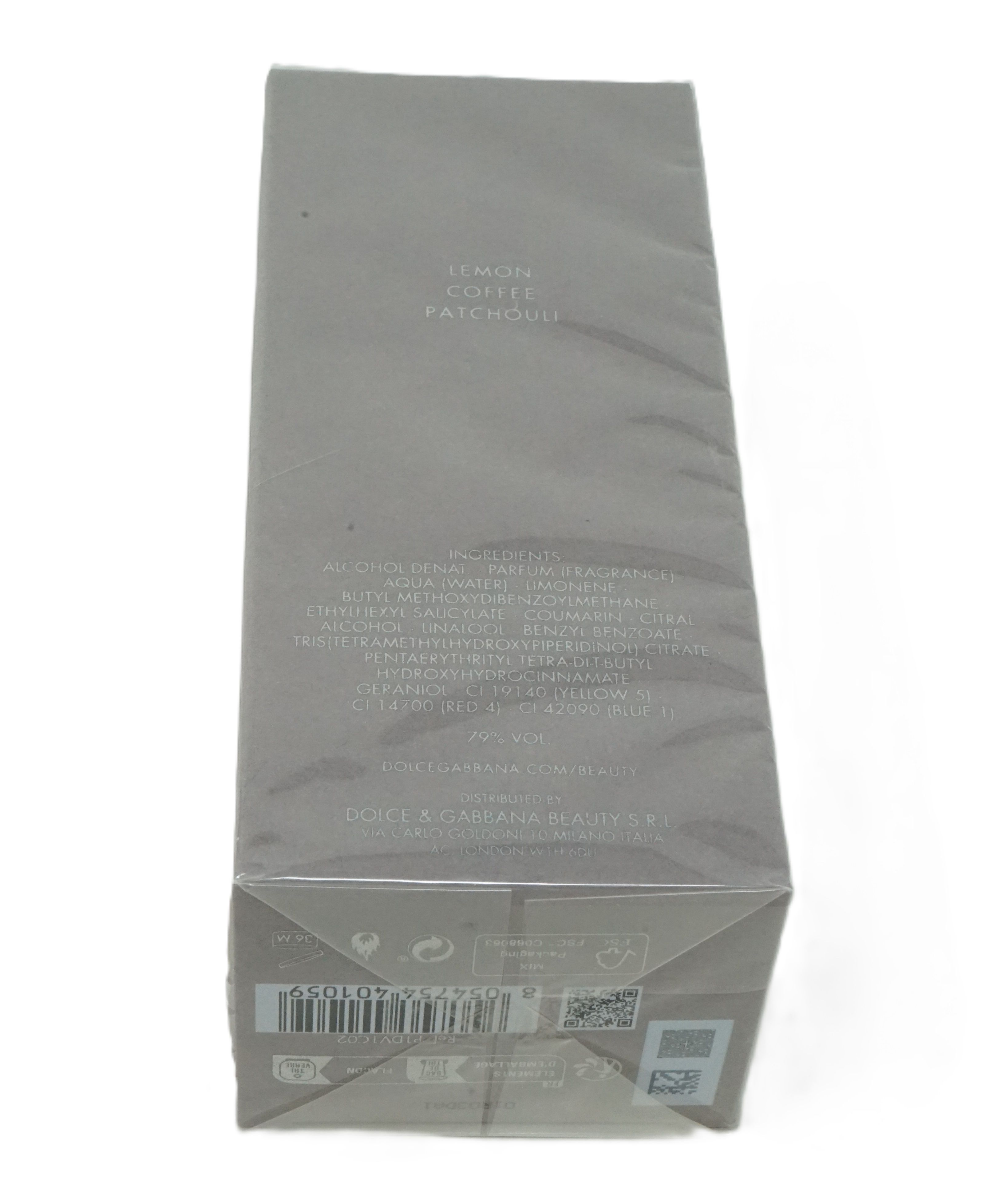 Confezione rettangolare grigia, parzialmente trasparente. Scritte: Lemon, Coffee, Patchouli. Codice a barre e altre informazioni in basso.