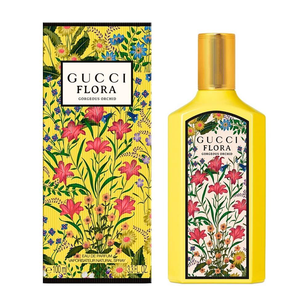 Flacone e confezione gialli con motivo floreale. Scritta: Gucci Flora Gorgeous Orchid.