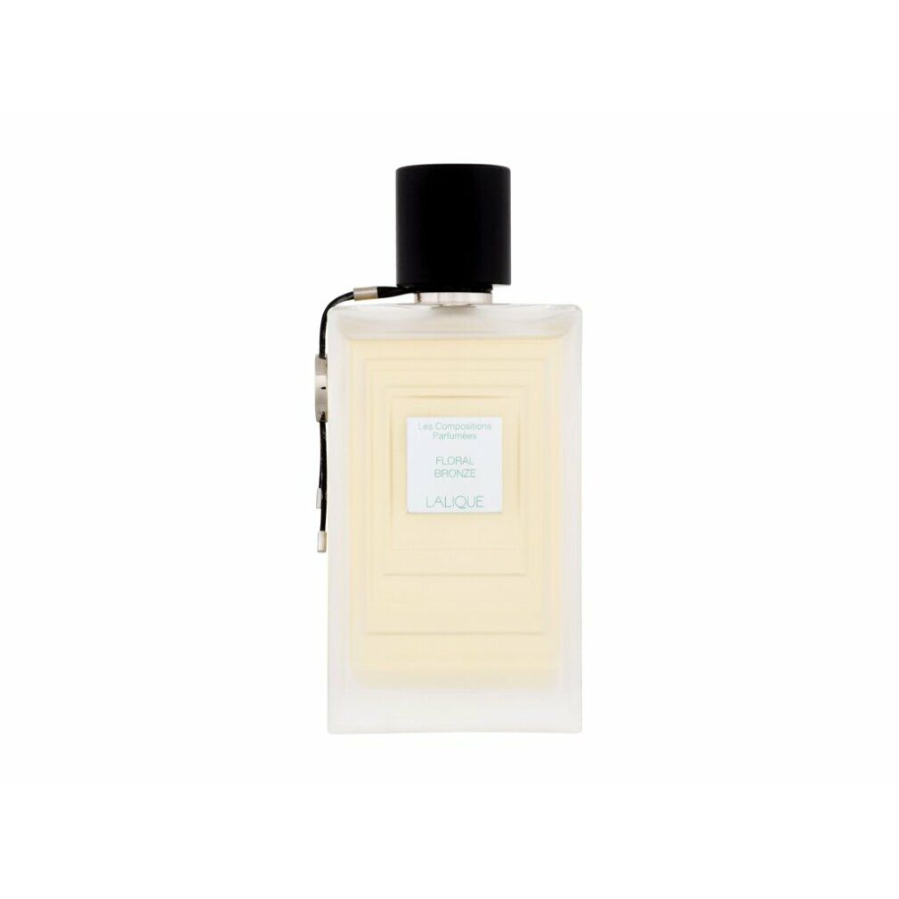 Flacone rettangolare con tappo nero. Scritta: Floral Bronze, Lalique. Profumo chiaro.