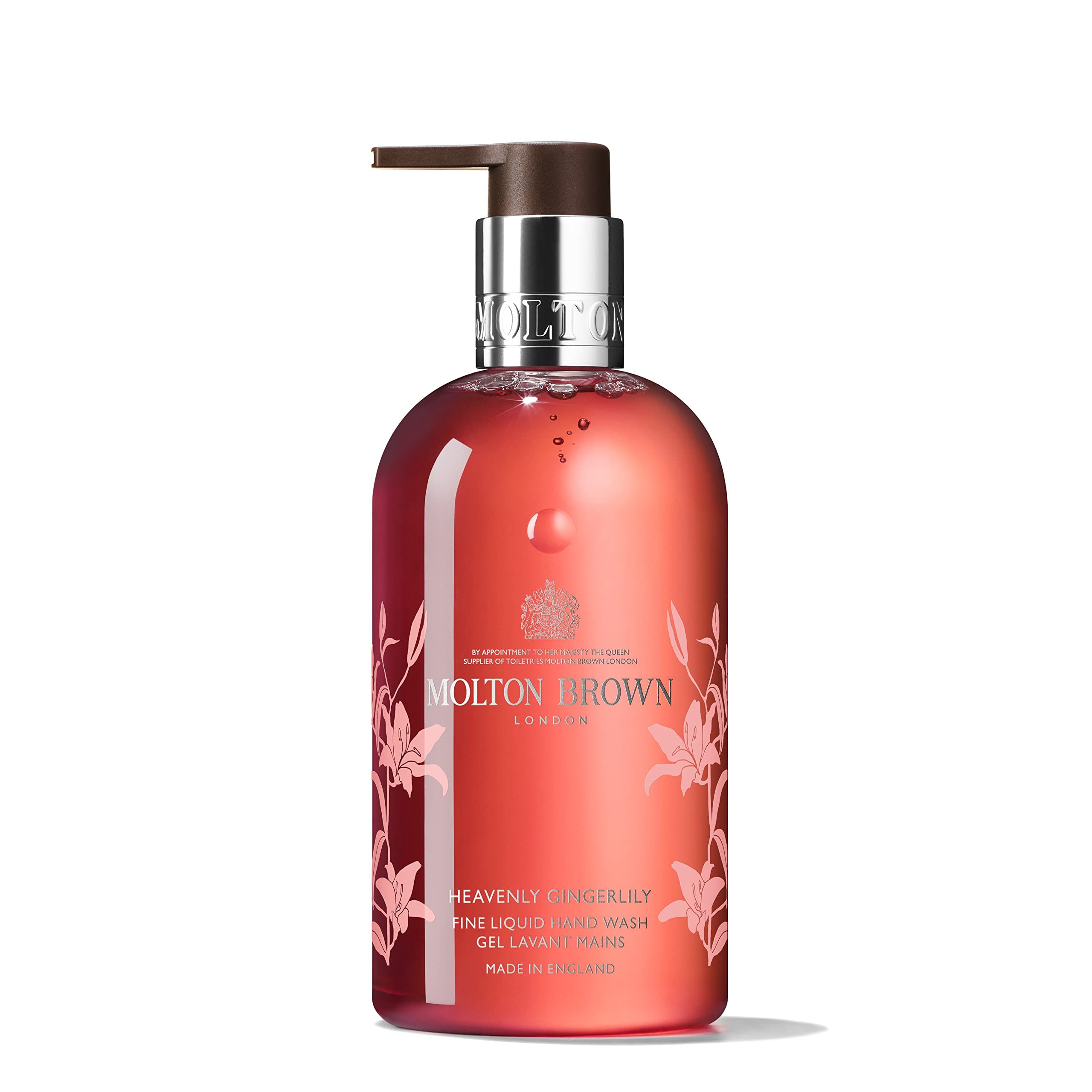 Sapone liquido rosso con dispenser. Scritta: Molton Brown, Heavenly Gingerlily. Decorazioni floreali.