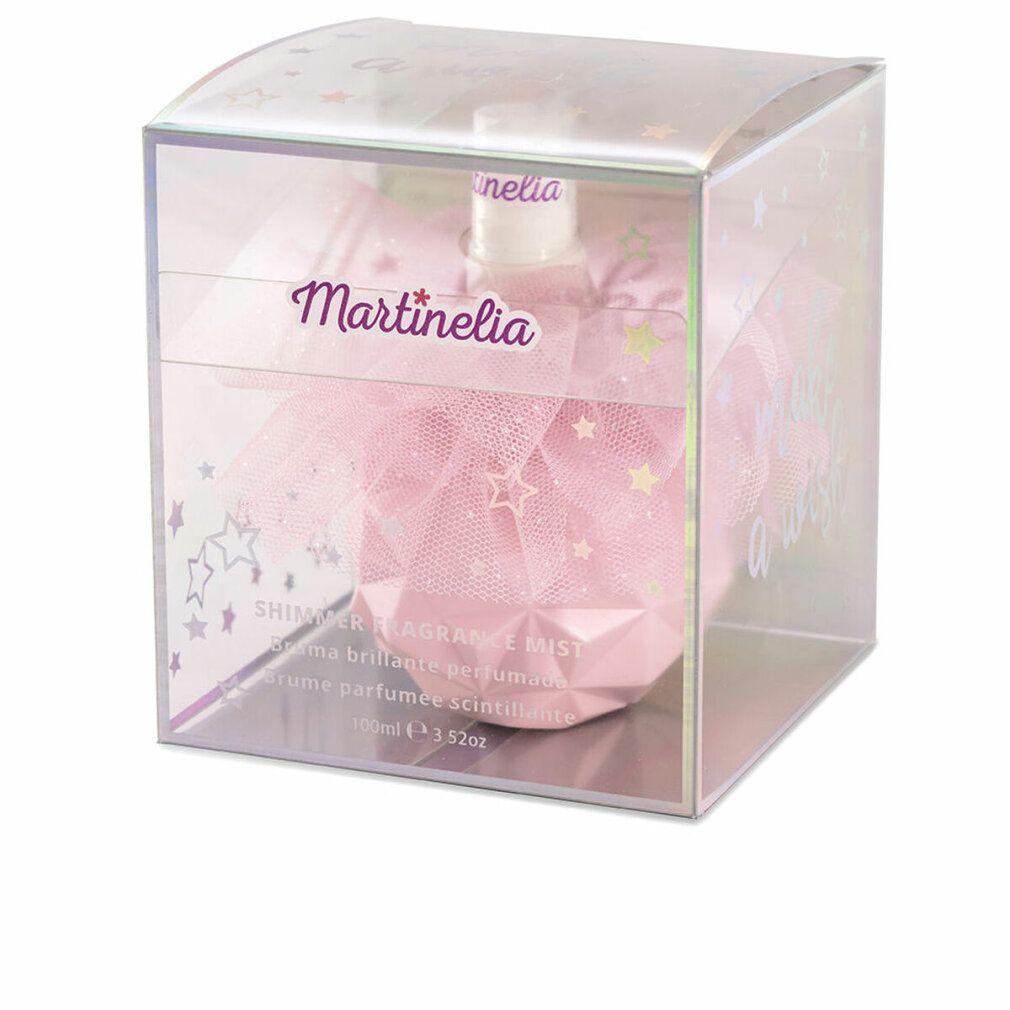 Flacone rosa in scatola trasparente. Scritta Martinelia. Testo: Shimmer Fragrance Mist. Stelle e glitter.