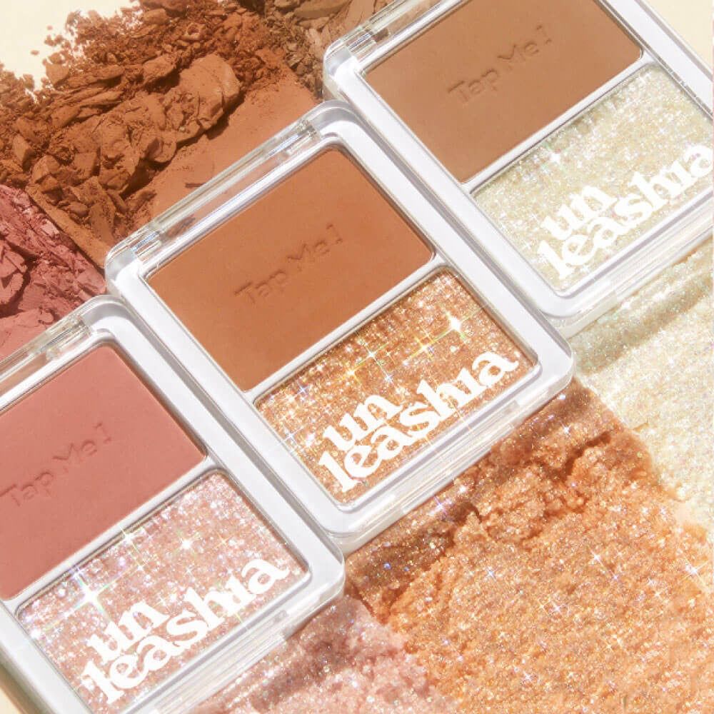 Tre prodotti UNLEASHIA Tap Me Palette Duo. Due colori per palette. Testo: Tap Me!, Unleashia.