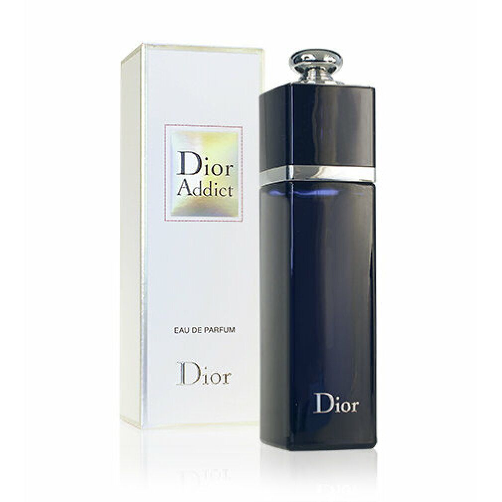 Flacone e confezione Dior Addict Eau de Parfum. Flacone blu scuro, tappo argentato. Confezione bianca con logo.