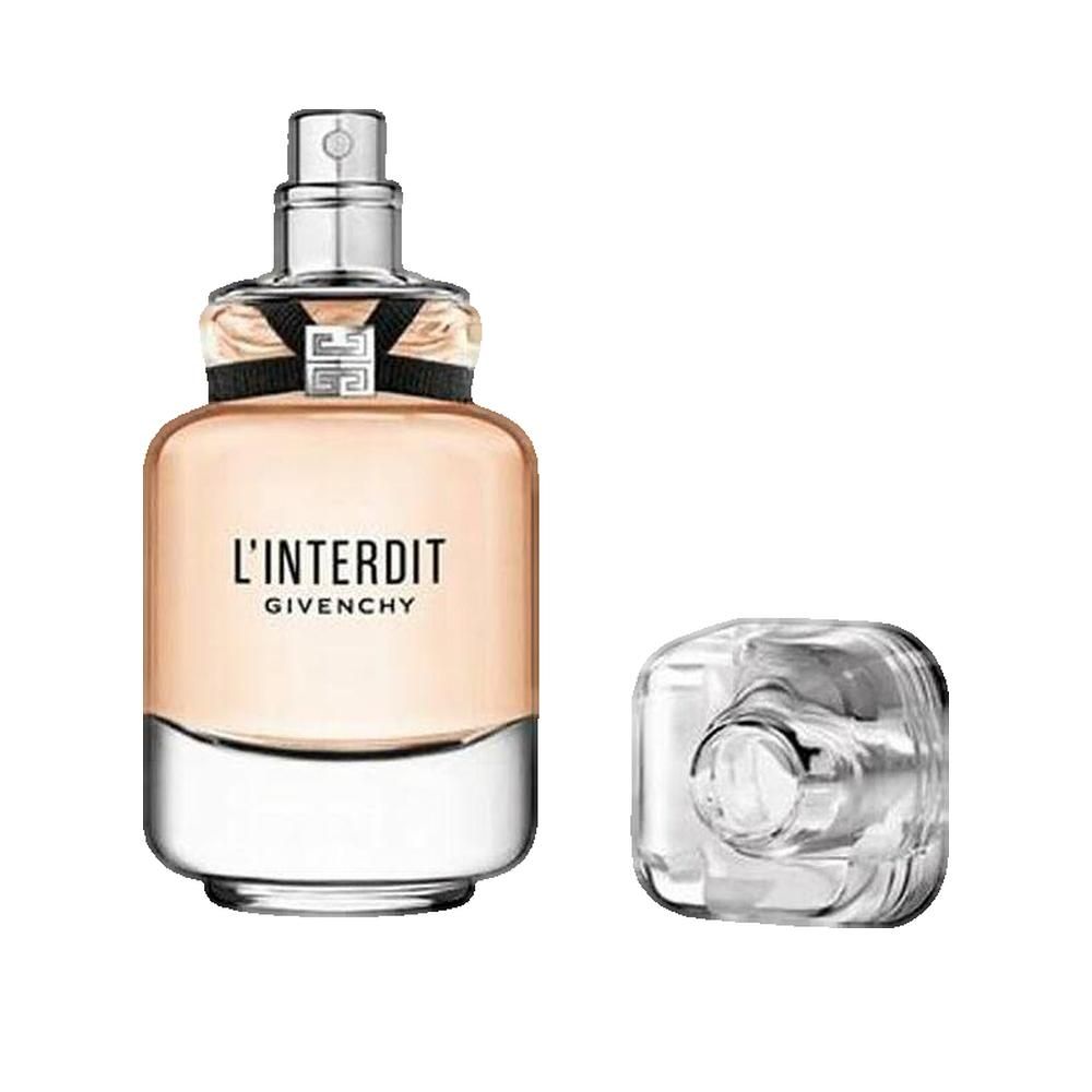 Flacone di profumo con vaporizzatore e tappo separato. Scritta "L'Interdit Givenchy". Flacone in vetro, tappo trasparente.