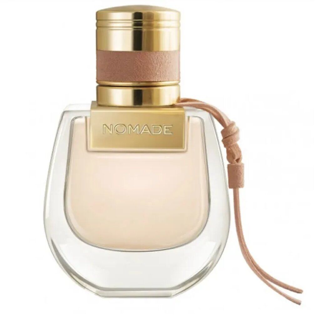 Flacone di profumo con tappo dorato e cinturino in pelle rosa. Scritta: NOMADE.