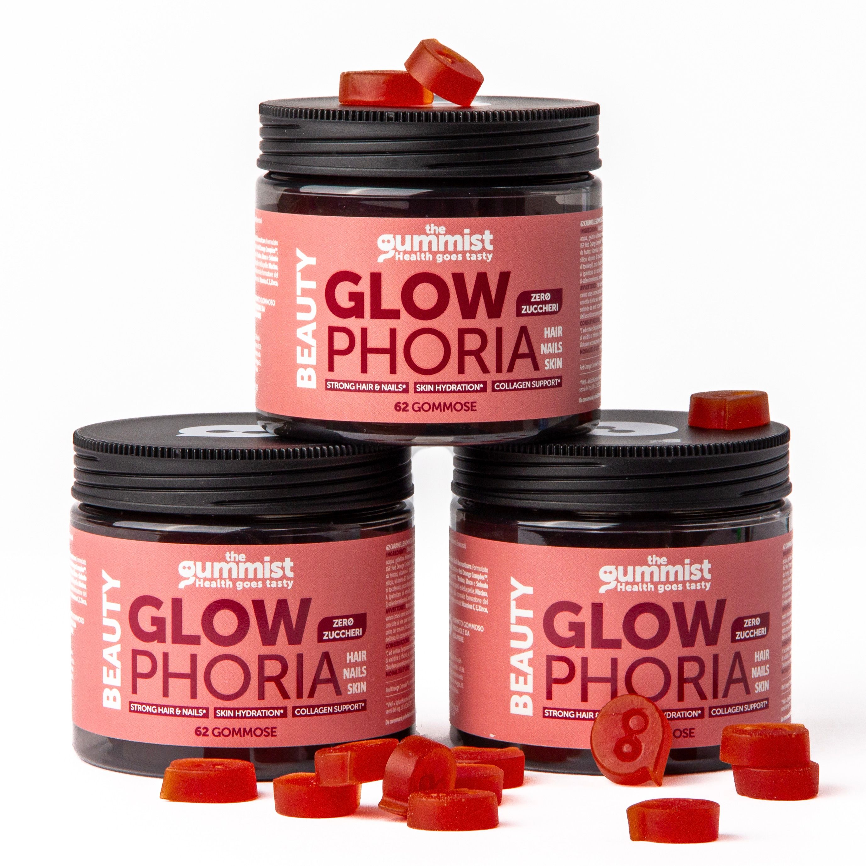 Tre barattoli di caramelle gommose. Scritta: Glowphoria. Caramelle gommose accanto. Coperchi neri, etichette rosa.