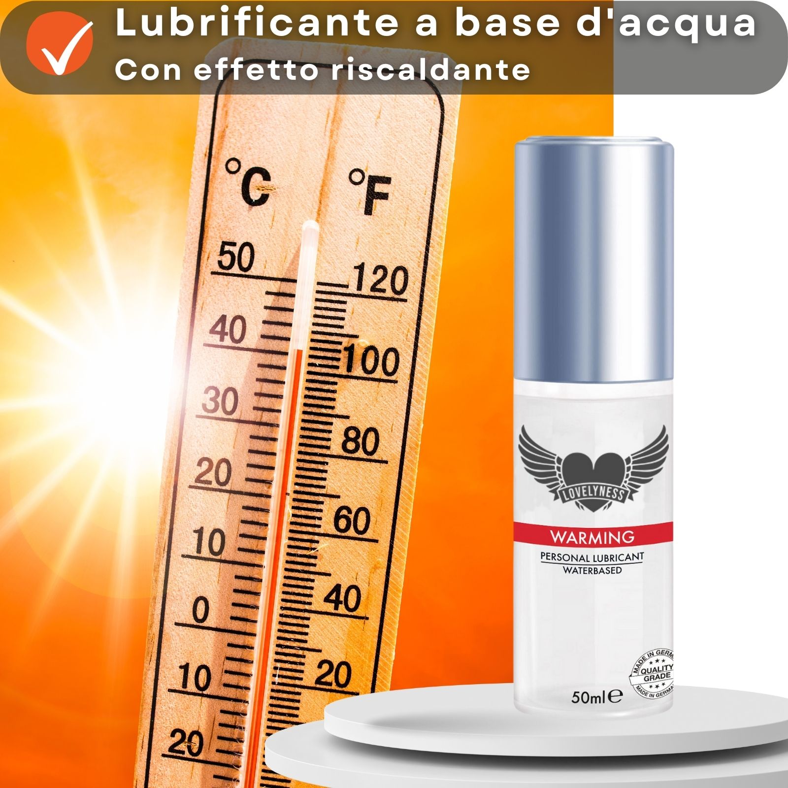 Flacone di gel lubrificante accanto a un termometro. Testo: "Lubrificante a base d'acqua", "Con effetto riscaldante".