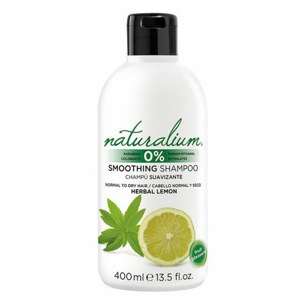 Flacone bianco con tappo nero. Scritta: Naturalium 0% Smoothing Shampoo Herbal Lemon. Immagine: limone e foglia.