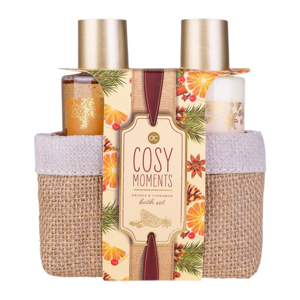 Set regalo con due cesti contenenti prodotti. Etichetta "Cosy Moments Orange & Cannelle". Decorazioni con arance e cannella.
