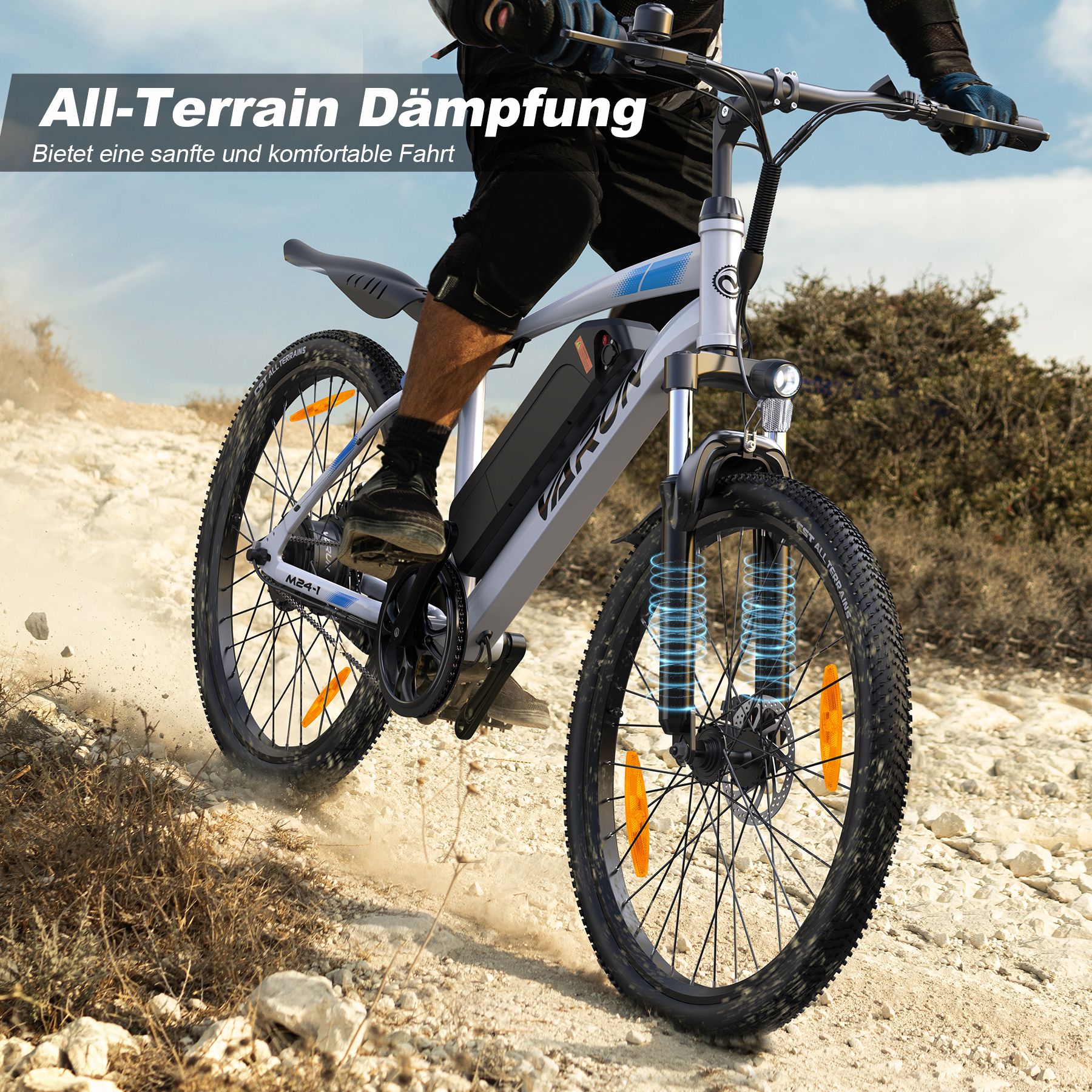 E-bike su terreno accidentato. Ammortizzazione All-Terrain. E-bike bianca con componenti neri. Ciclista.