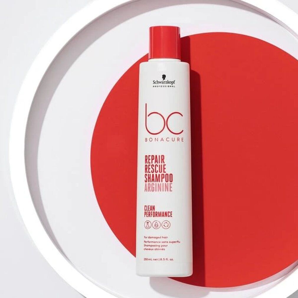 Shampoo bianco con tappo rosso. Scritta: BC Bonacure Repair Rescue Shampoo Arginine. Su cerchio rosso.