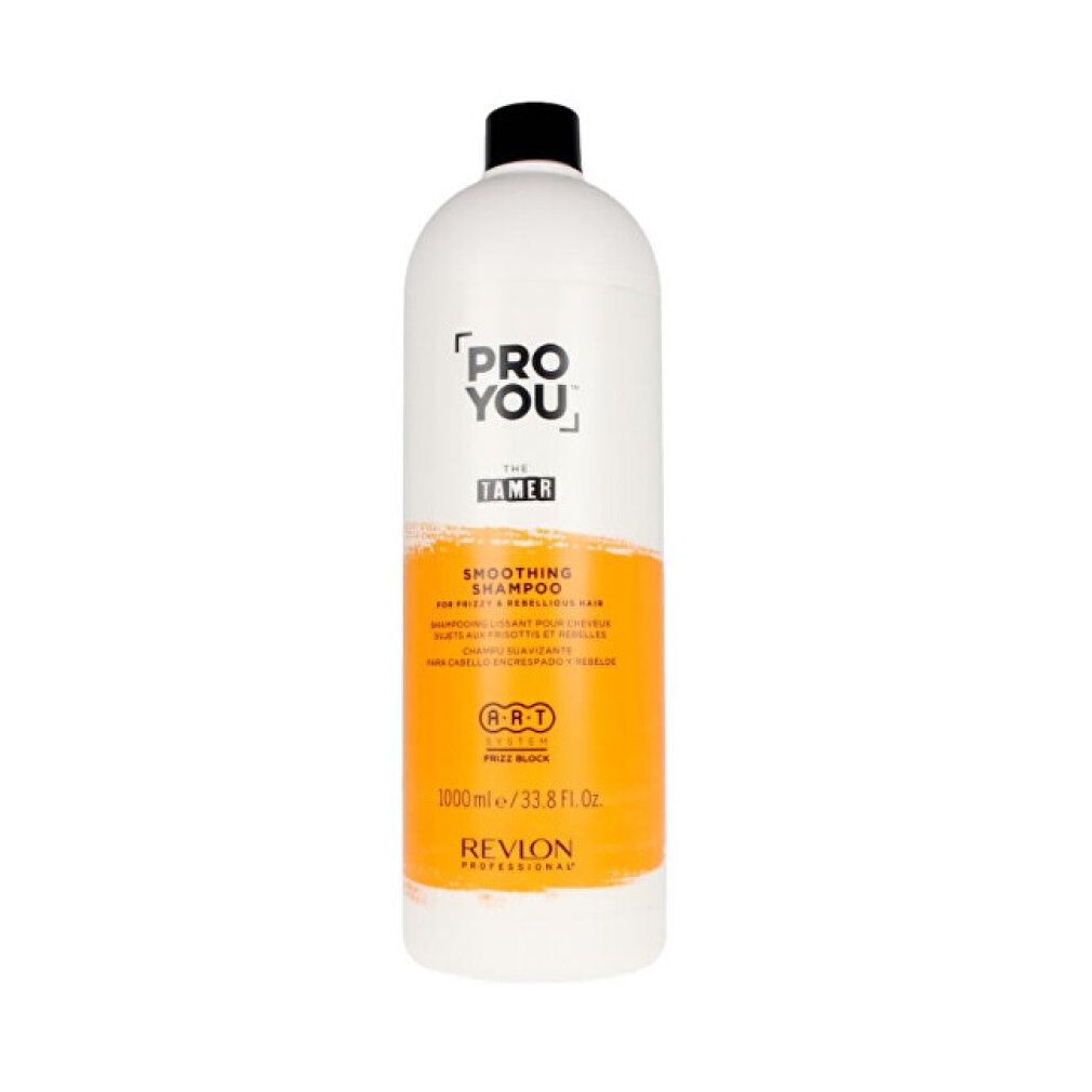 Grande flacone bianco con tappo nero. Scritta: PRO YOU THE TAMER, Smoothing Shampoo. Striscia arancione. Revlon Professional.