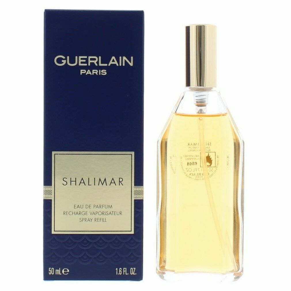 Scatola blu scuro e flacone. GUERLAIN PARIS e SHALIMAR sulla scatola. Flacone trasparente con tappo dorato.