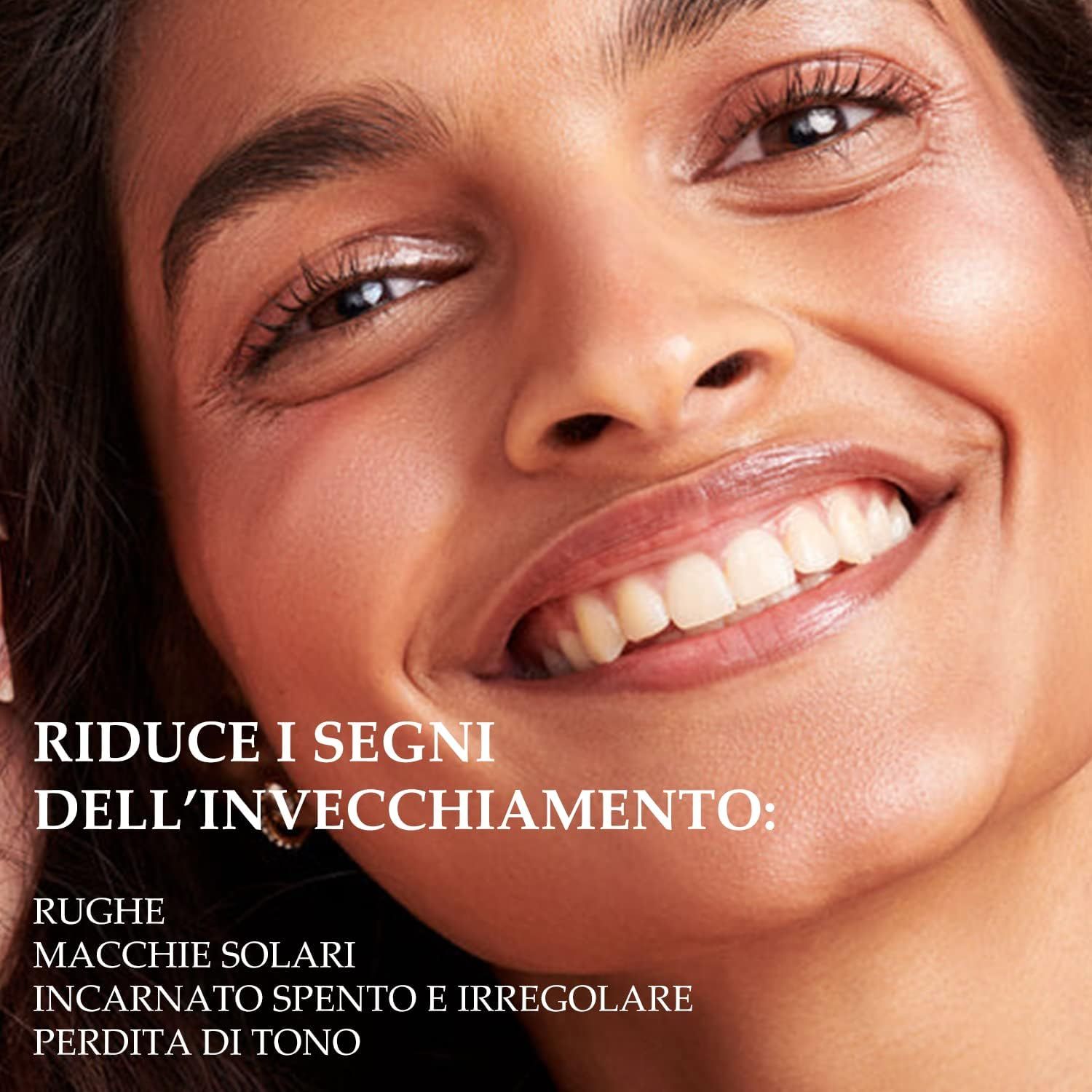 Volto di donna. Testo: Riduce i segni dell'invecchiamento: rughe, macchie solari, incarnato irregolare, perdita di tono.