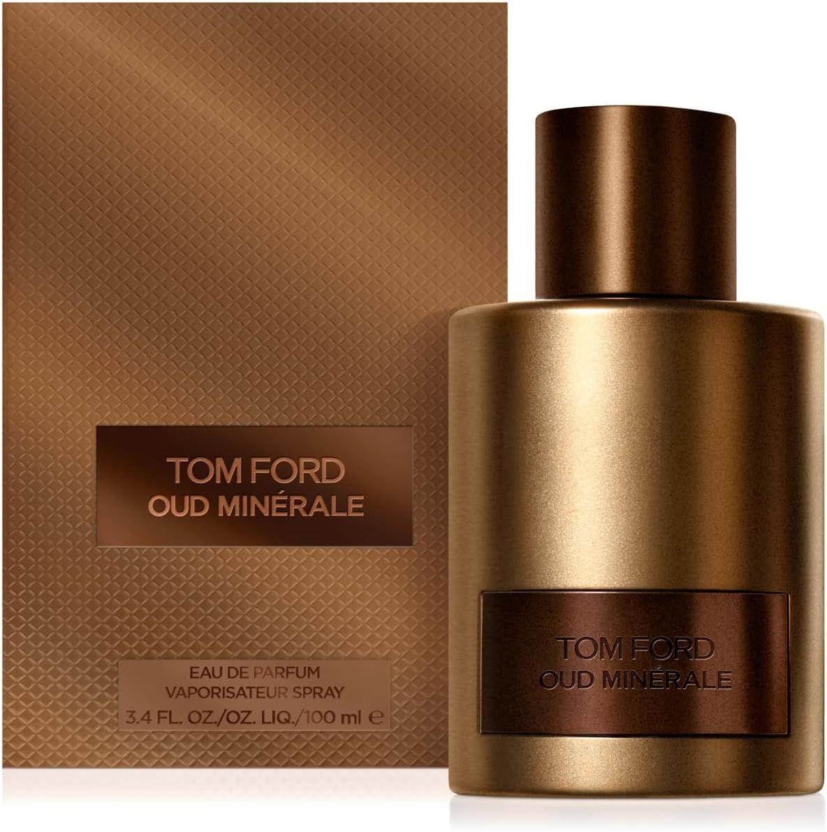 Flacone dorato, tappo marrone, etichetta rettangolare. Confezione marrone con testo TOM FORD OUD MINERALE.