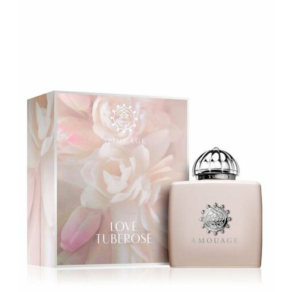 Flacone beige con tappo argentato e confezione. Scritta "AMOUAGE LOVE TUBEROSE". Confezione con motivo floreale.
