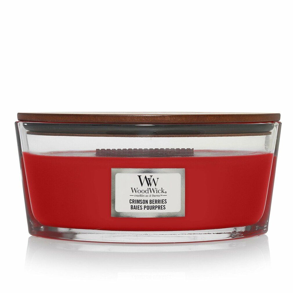 Candela rossa ellittica in vetro con coperchio in legno. Etichetta "Crimson Berries" e logo "WoodWick".