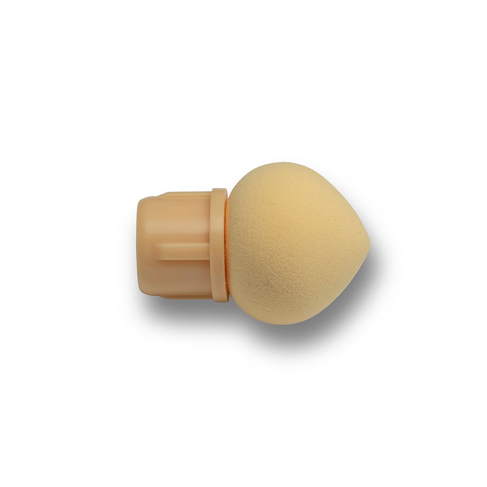 Applicatore per unghie beige con punta in spugna arrotondata e base cilindrica.
