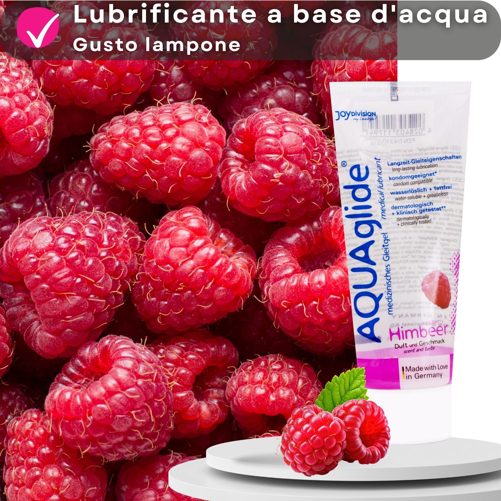 Tubo di gel AQUAglide Himbeere. Lamponi sullo sfondo. Testo: lubrificante a base d'acqua, gusto lampone.