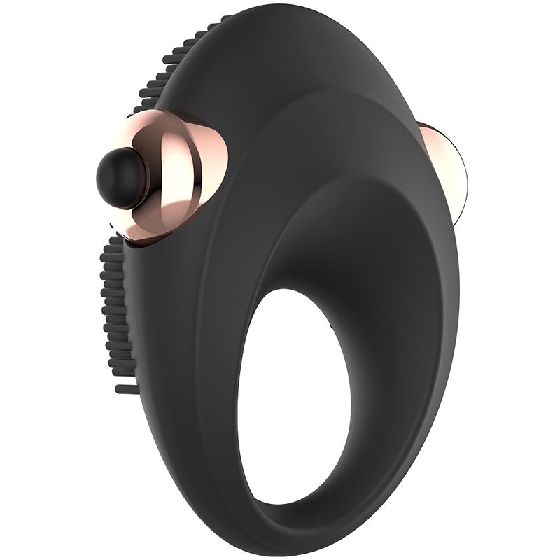 Anello vibrante per pene in silicone nero. Anulare con borchie e due elementi oro rosa. Pulsante nero.